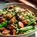 Leckeres Honig-Knoblauch-Hähnchen-Stir Fry mit Zuckererbsen